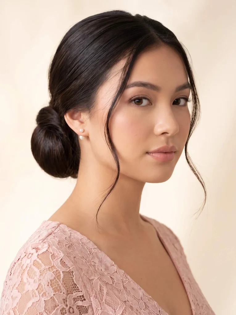 Sleek Low Bun With Tendrils