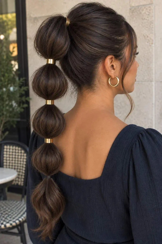 Bubble ponytail with gold cuffs