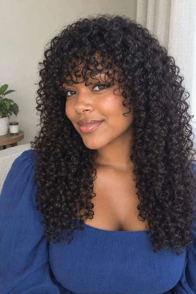 Curly sew-in with full bangs