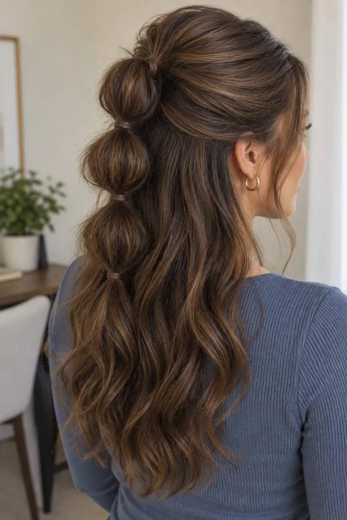 Half-up bubble ponytail style
