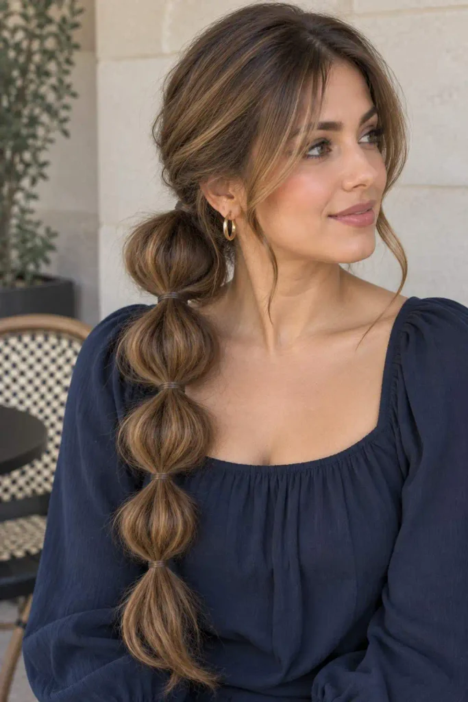 Side bubble ponytail with volume